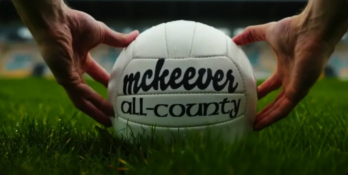 Hands holding a McKeever All-County football