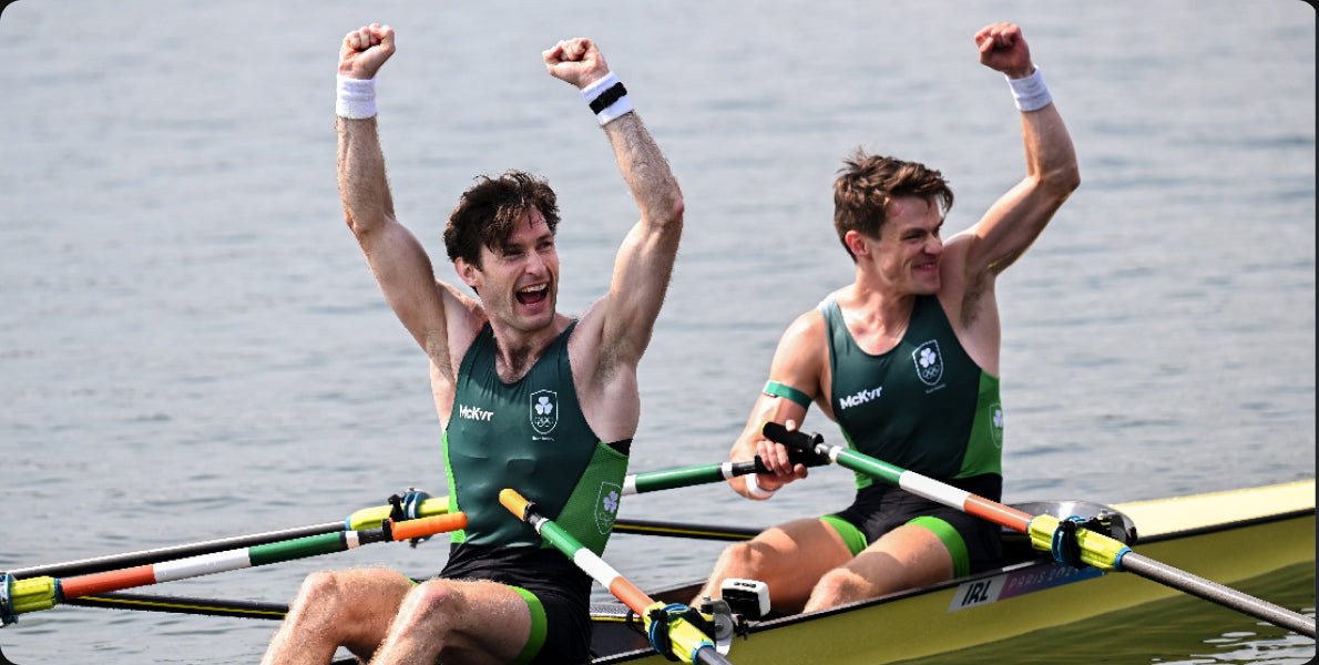 Irish rowers celebrating in Team Ireland kit