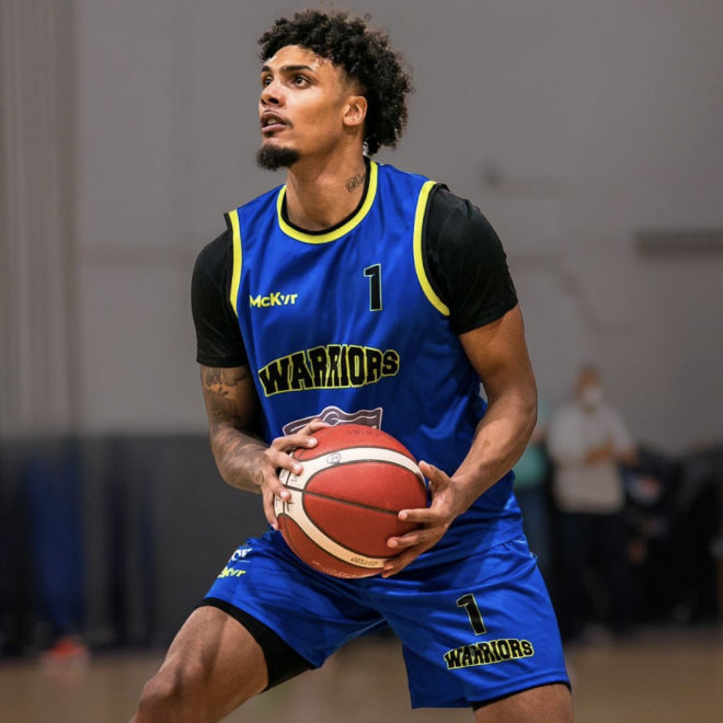 Basketball player in a McKvr jersey