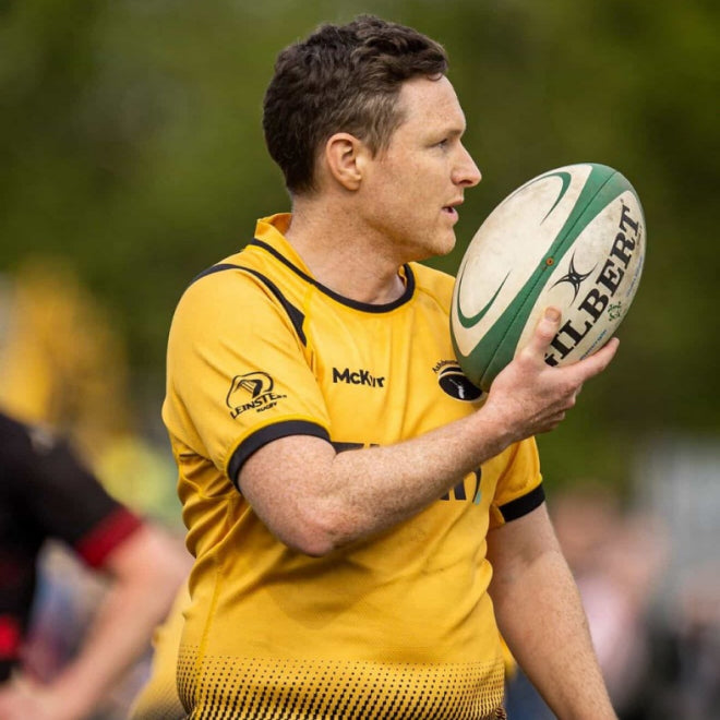 Rugby referee in a McKvr jersey